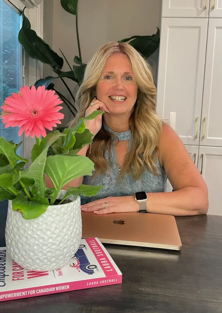 Image of Susan Sills with a flower on the table